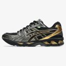 Black and gold Senna Gel Kayano 14 sneaker with mesh and metallic trim
