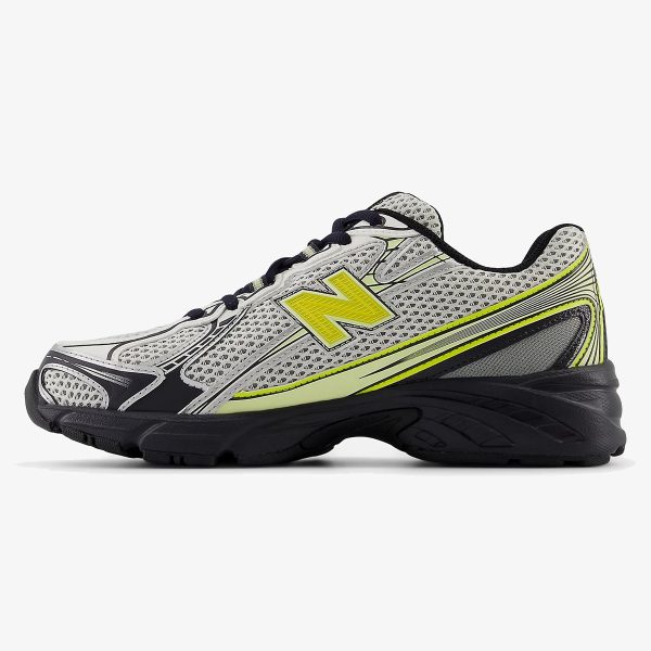 White, black, and yellow NB 740v2 sneaker with silver overlay details