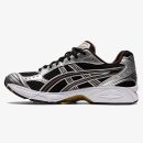 Gel-Kayano 14 Black Coffee runner with dark mesh, brown accents, and metallic side stripes