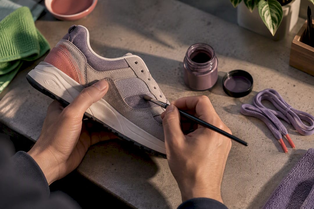 Hands customizing textured sneaker materials