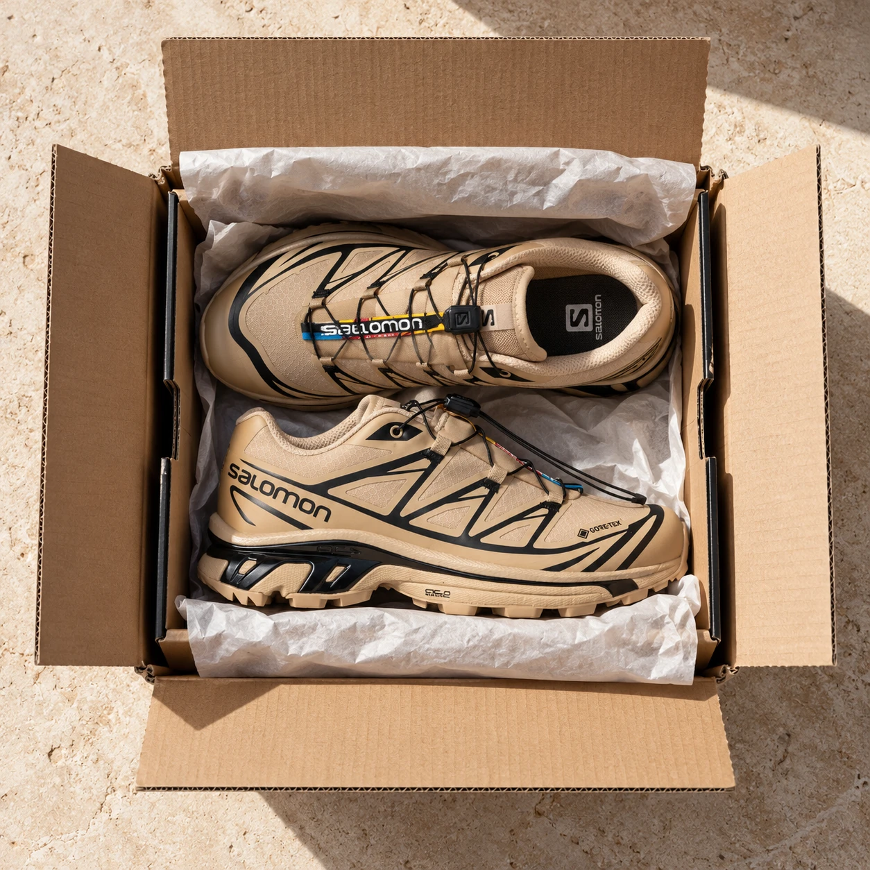 A pair of sneakers packed inside a shipping box